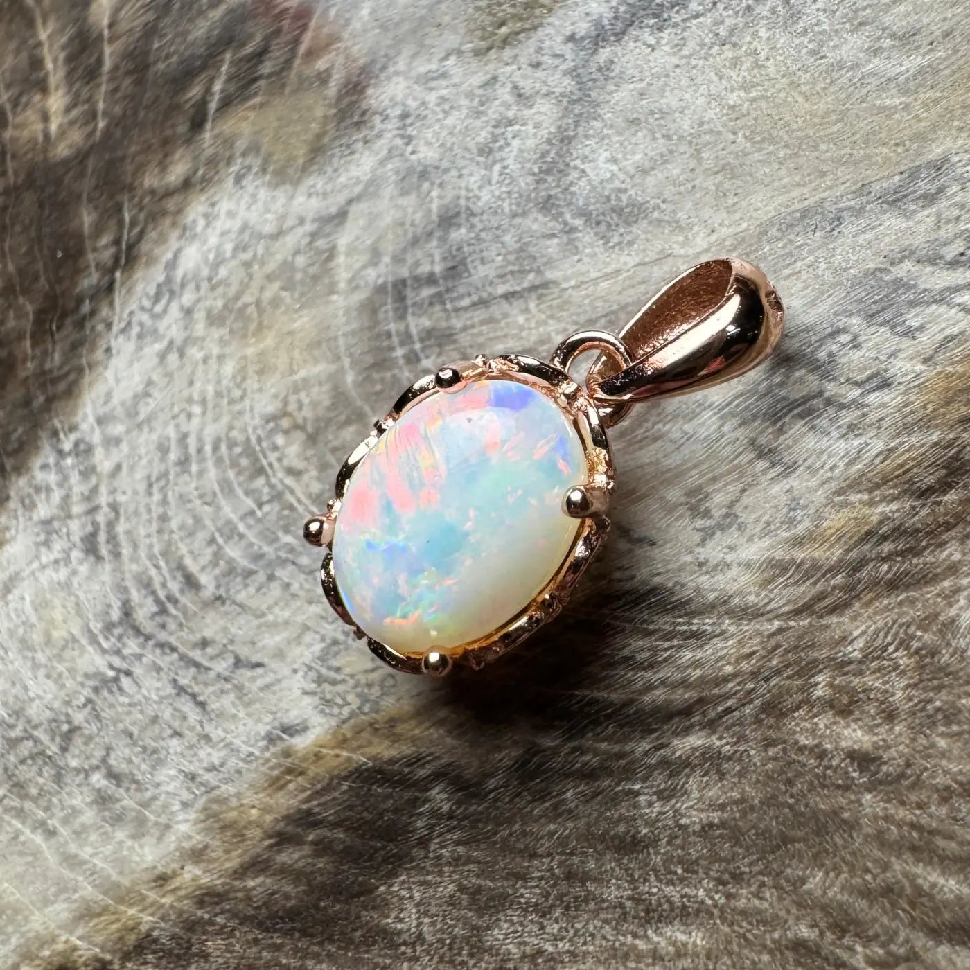 Oval opal pendant with rose gold setting from Larapinta Flame handcrafted sterling silver design