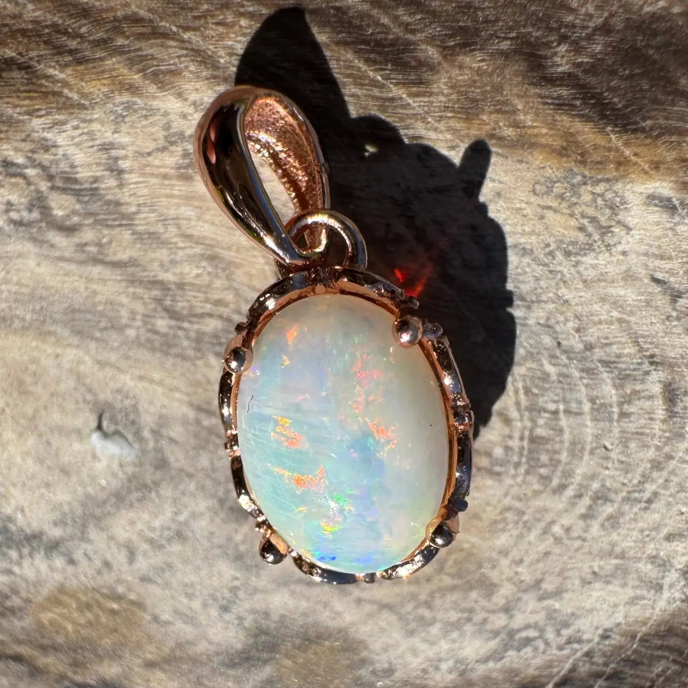 Rose gold opal pendant from Larapinta Flame crafted with Coober Pedy opal and sterling silver