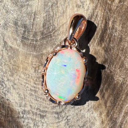 Rose gold opal pendant from Larapinta Flame crafted in sterling silver with Coober Pedy opal