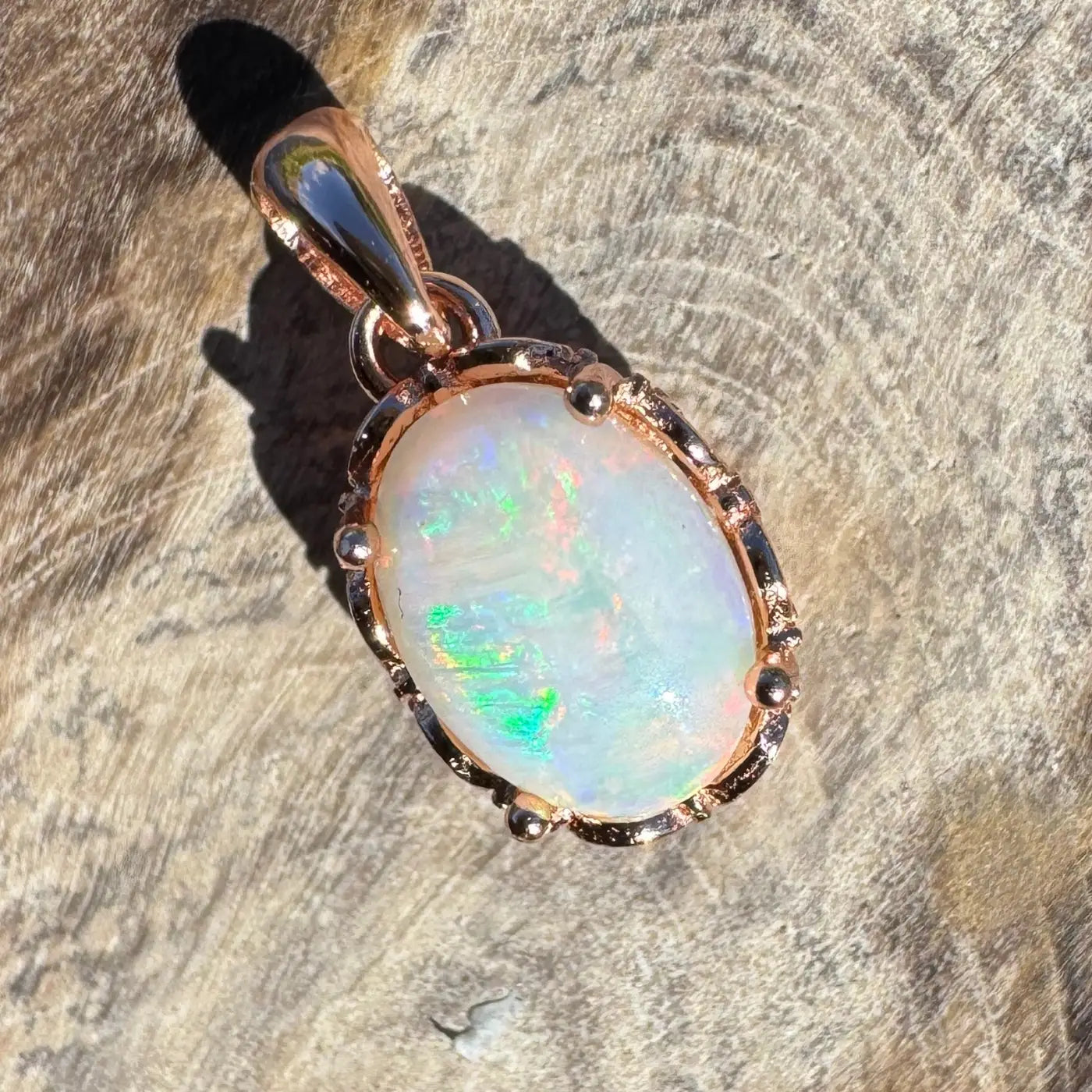 Oval opal pendant with rose gold setting in handcrafted Larapinta Flame jewelry piece