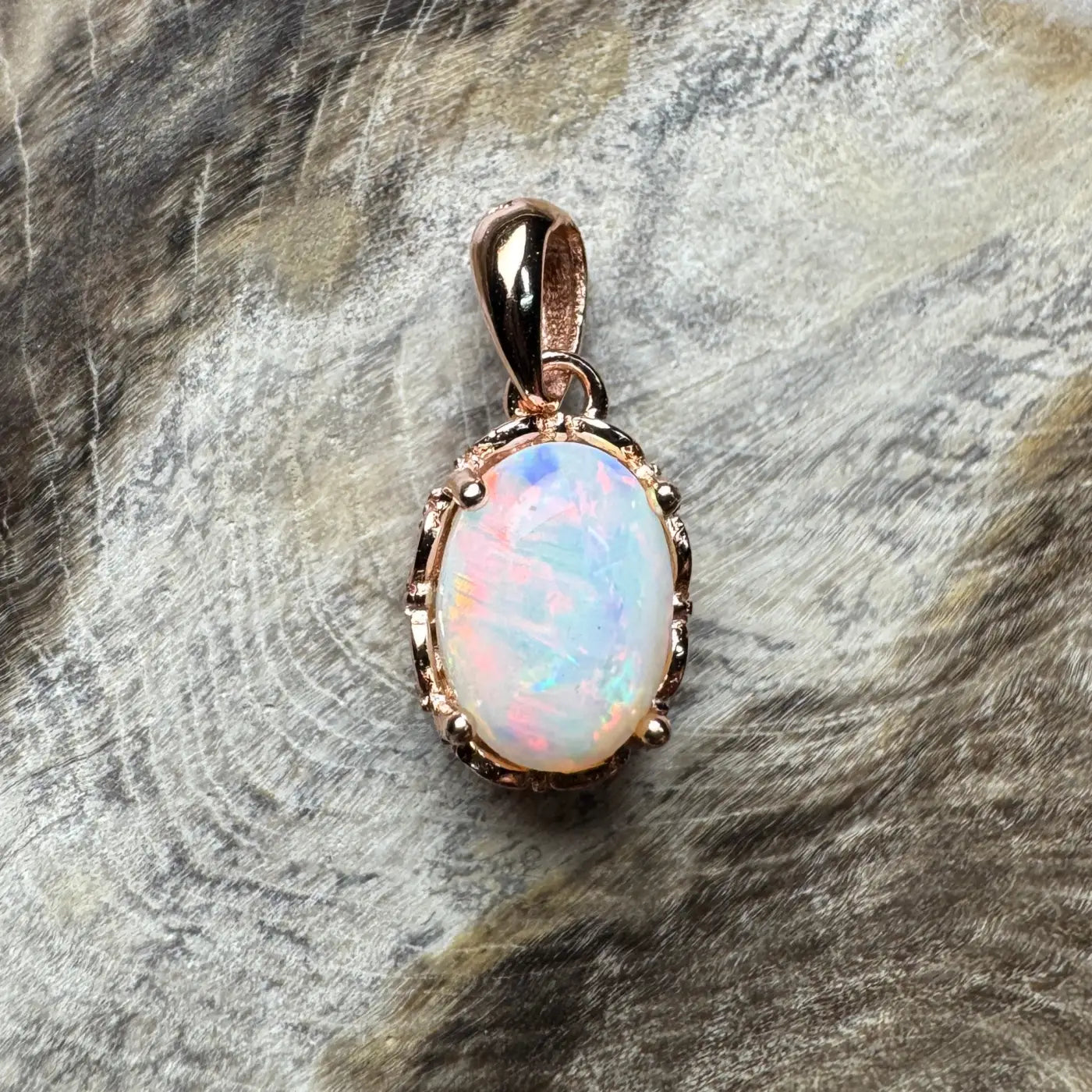 Rose gold opal pendant from Larapinta Flame featuring handcrafted 0.8ct Coober Pedy opal