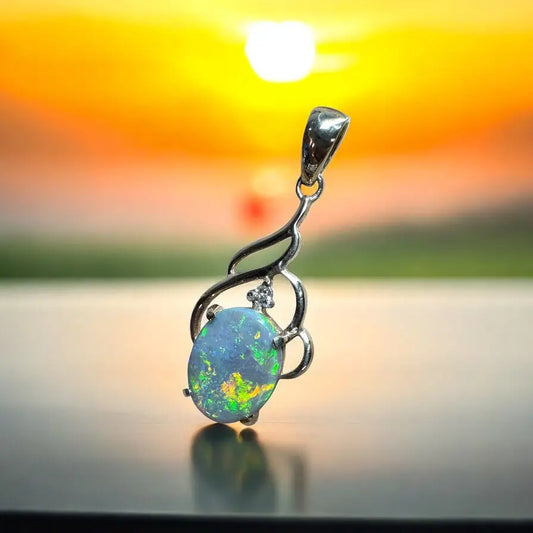 Silver opal pendant featuring a 2.6-carat Lightning Ridge semi-black opal and diamonds in Australian gold