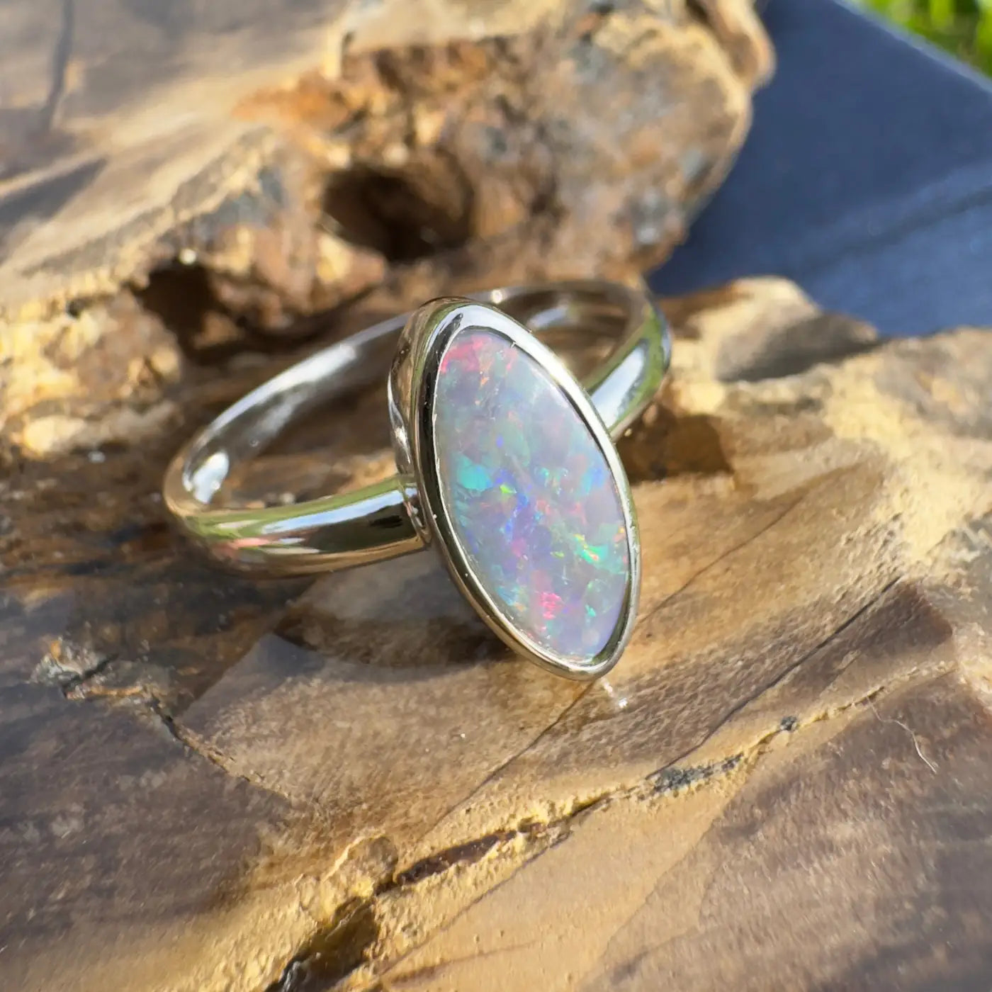 Silver ring with iridescent Lightning Ridge Opal showcasing handcrafted elegance