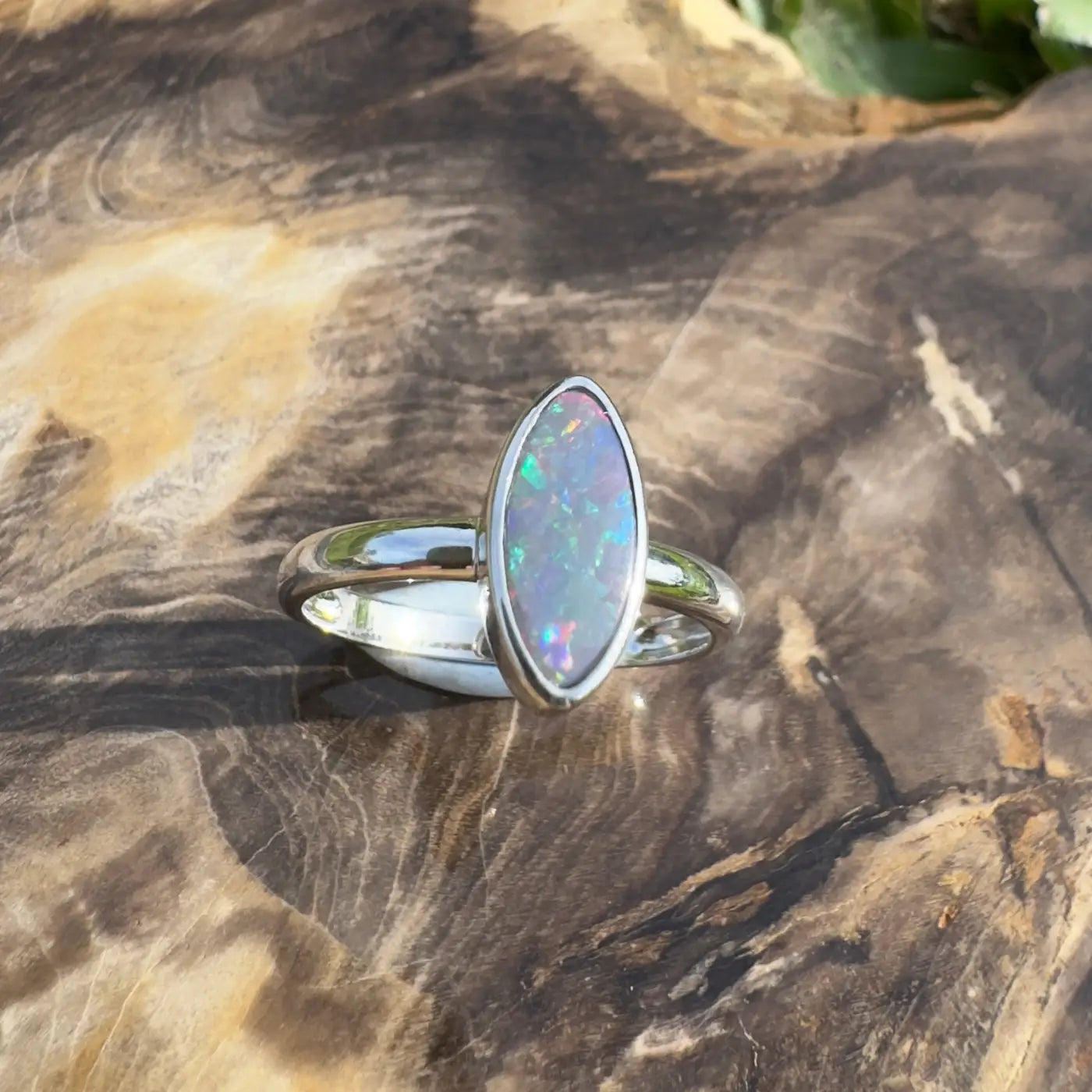 Silver ring with iridescent marquise-cut Lightning Ridge Opal in handcrafted sterling silver setting