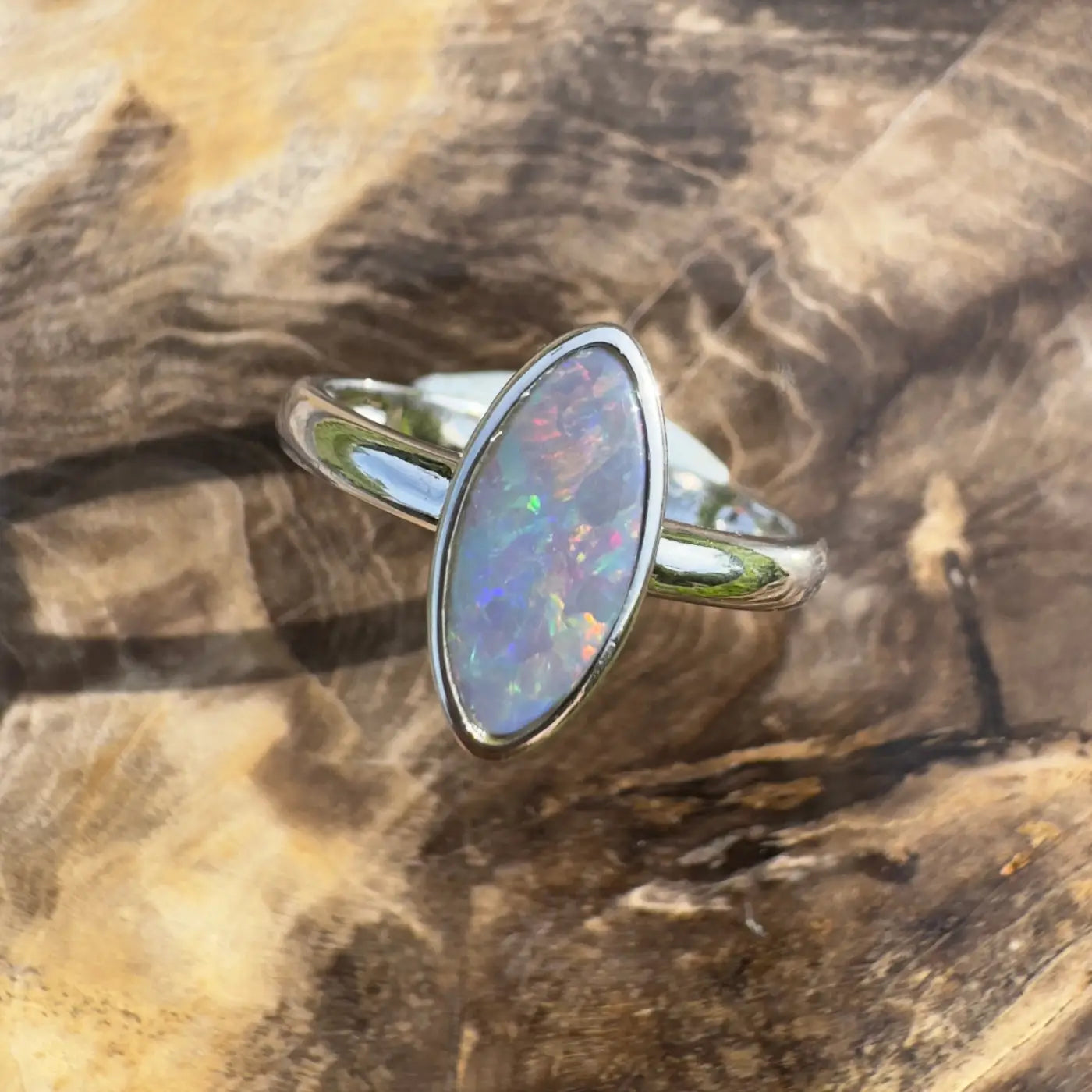 Silver ring featuring iridescent Lightning Ridge Opal in a handcrafted Sterling Silver design