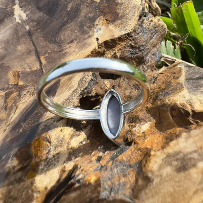 Silver ring with dark Lightning Ridge Opal showcasing handcrafted elegance and sterling silver craftsmanship