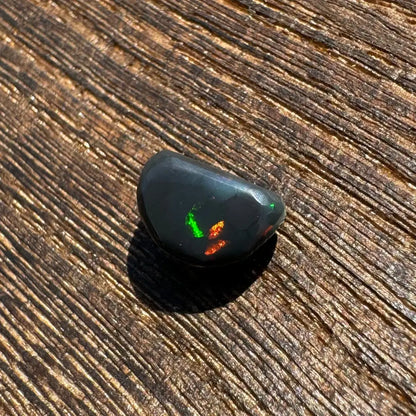 Polished Lightning Ridge Black Opal 1.4 carats with vibrant green and orange flashes
