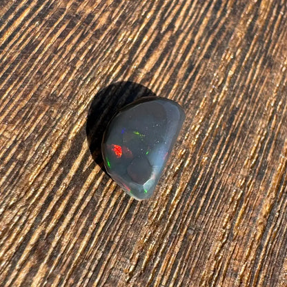 Polished Lightning Ridge Black Opal 1.4 carat with vibrant colorful flashes