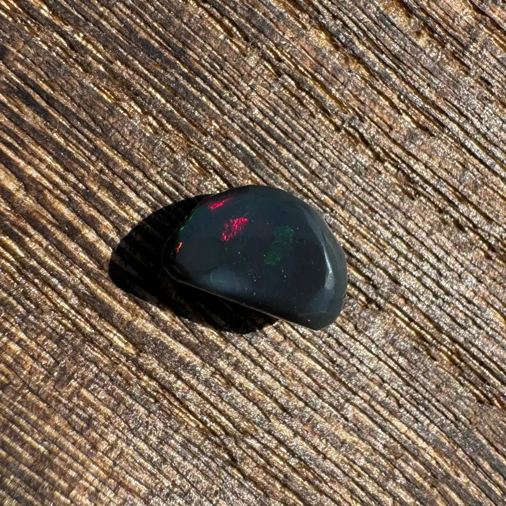 Polished Lightning Ridge Black Opal 1.4 carats with vivid red and green flashes