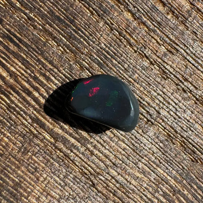 Polished Lightning Ridge Black Opal 1.4 carats with vivid red and green flashes