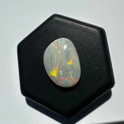 Iridescent white opal gemstone from Lightning Ridge in a 2.4 Carat Solid Hand-Cut setting
