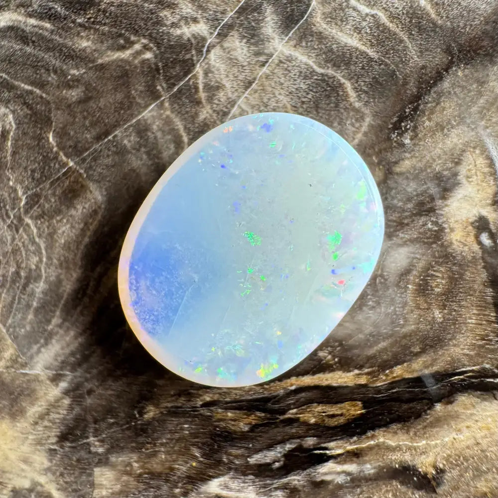 Iridescent oval opal cabochon from Lightning Ridge in a 3.5-carat solid hand-cut masterpiece
