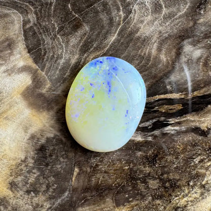 Oval opal cabochon with vibrant blue and yellow play-of-color from Lightning Ridge Opal 3.5carat