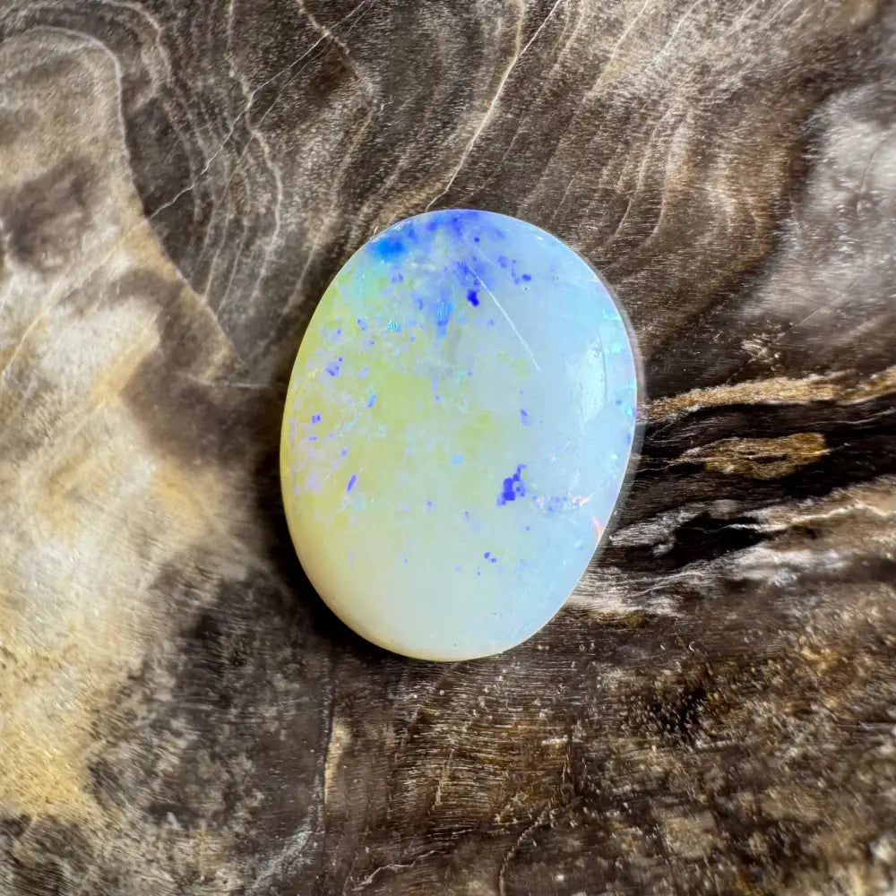 Oval Lightning Ridge Opal gemstone with blue and yellow inclusions, 3.5 carats solid hand-cut
