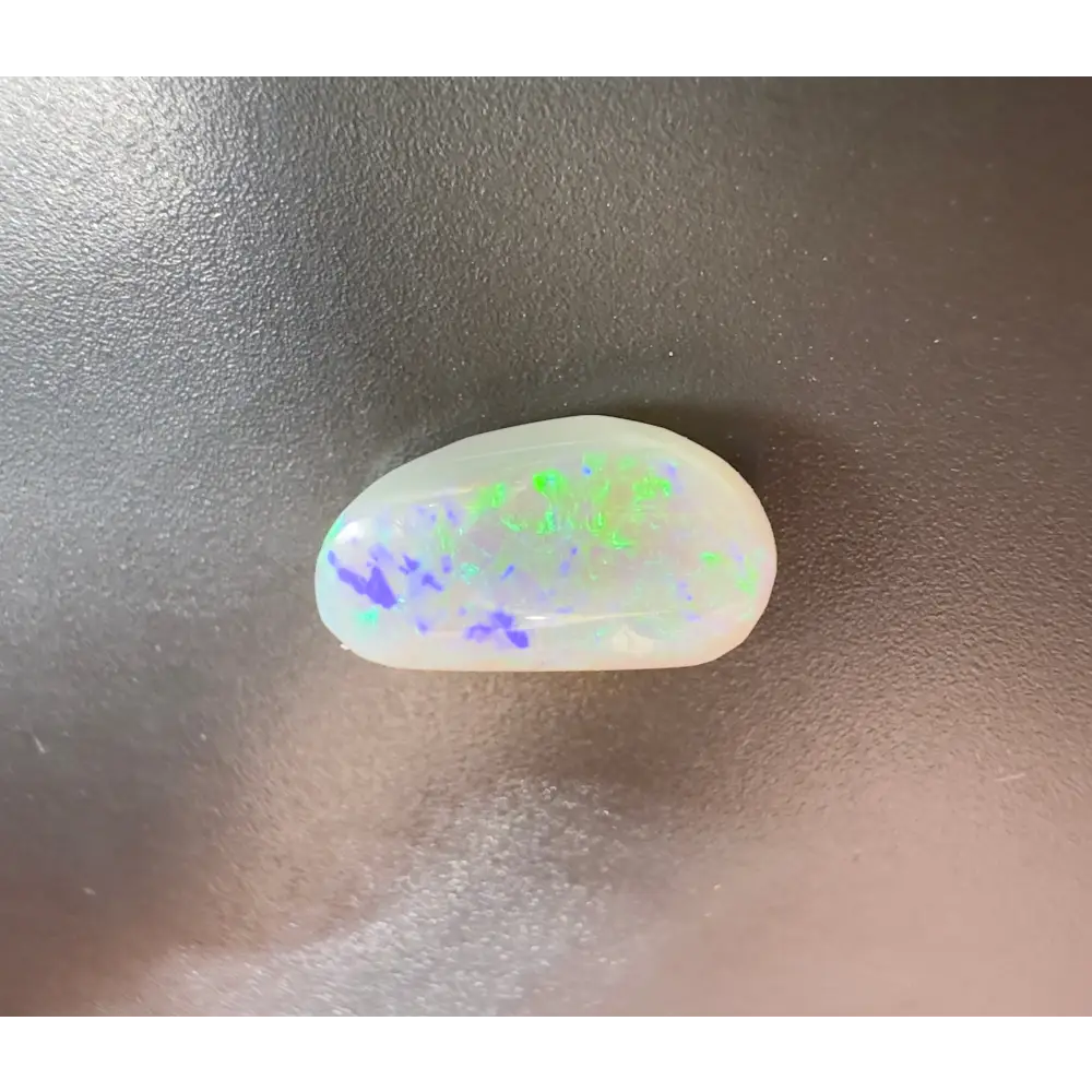 Polished Lightning Ridge Semi Black Opal 1.2 carat with green and purple color flashes