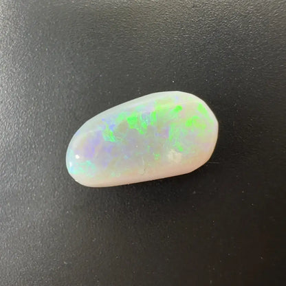 Iridescent Lightning Ridge Semi Black Opal gemstone showcasing vibrant play of color
