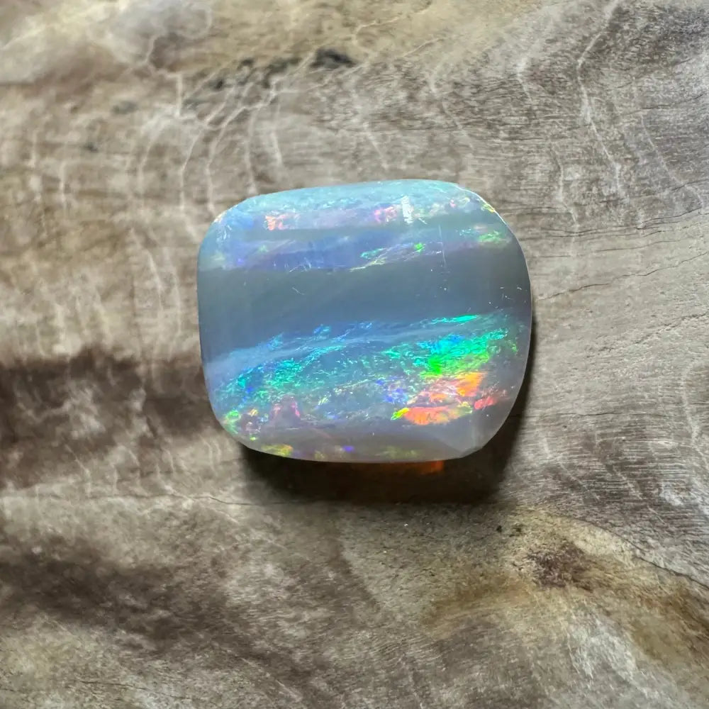 Iridescent Lightning Ridge Semi Black Opal 3.5 Carat Solid Hand-Cut gemstone displayed
