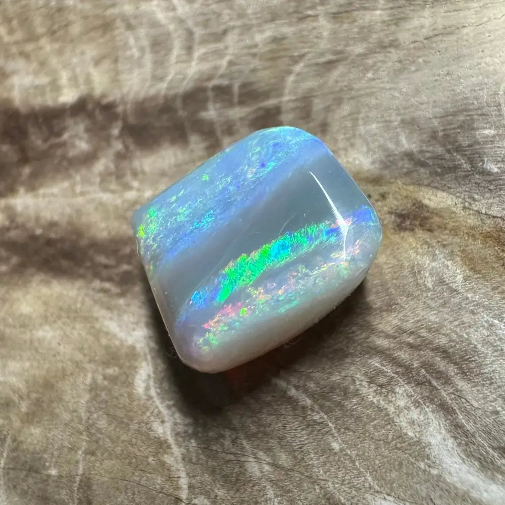 Iridescent Lightning Ridge Semi Black Opal gemstone in a 3.5carat solid hand-cut display