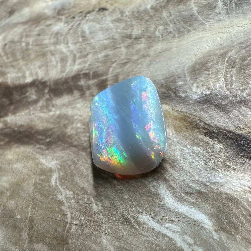 Iridescent Lightning Ridge Semi Black Opal gemstone in a 3.5 carat solid hand-cut setting