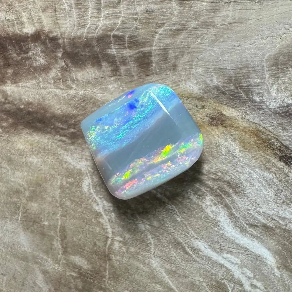 Iridescent Lightning Ridge Semi Black Opal gemstone displayed in a 3.5carat solid hand-cut product