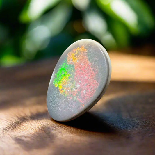 Oval opal cabochon with vibrant color play in Lightning Ridge Semi Black Opal 3.8carat solid hand-cut