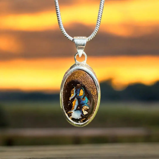 Silver opal pendant necklace from Natural Wonders featuring a solid Queensland Boulder Opal in 925 Sterling Silver