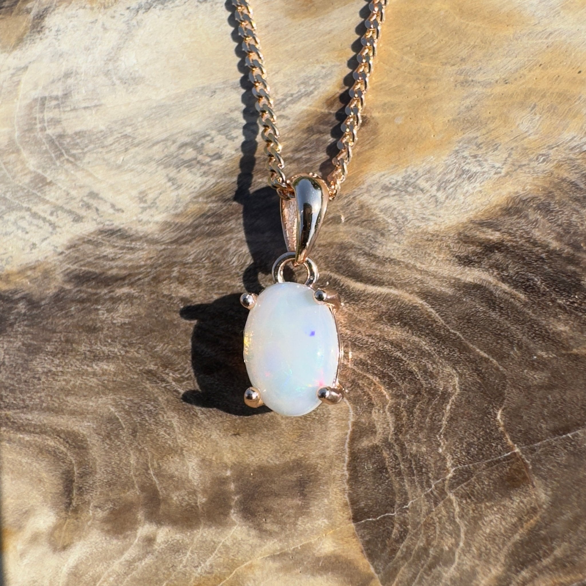 Nullarbor Grace - 0.6ct Coober Pedy Opal Rose Gold Coated 925 Silver Pendant