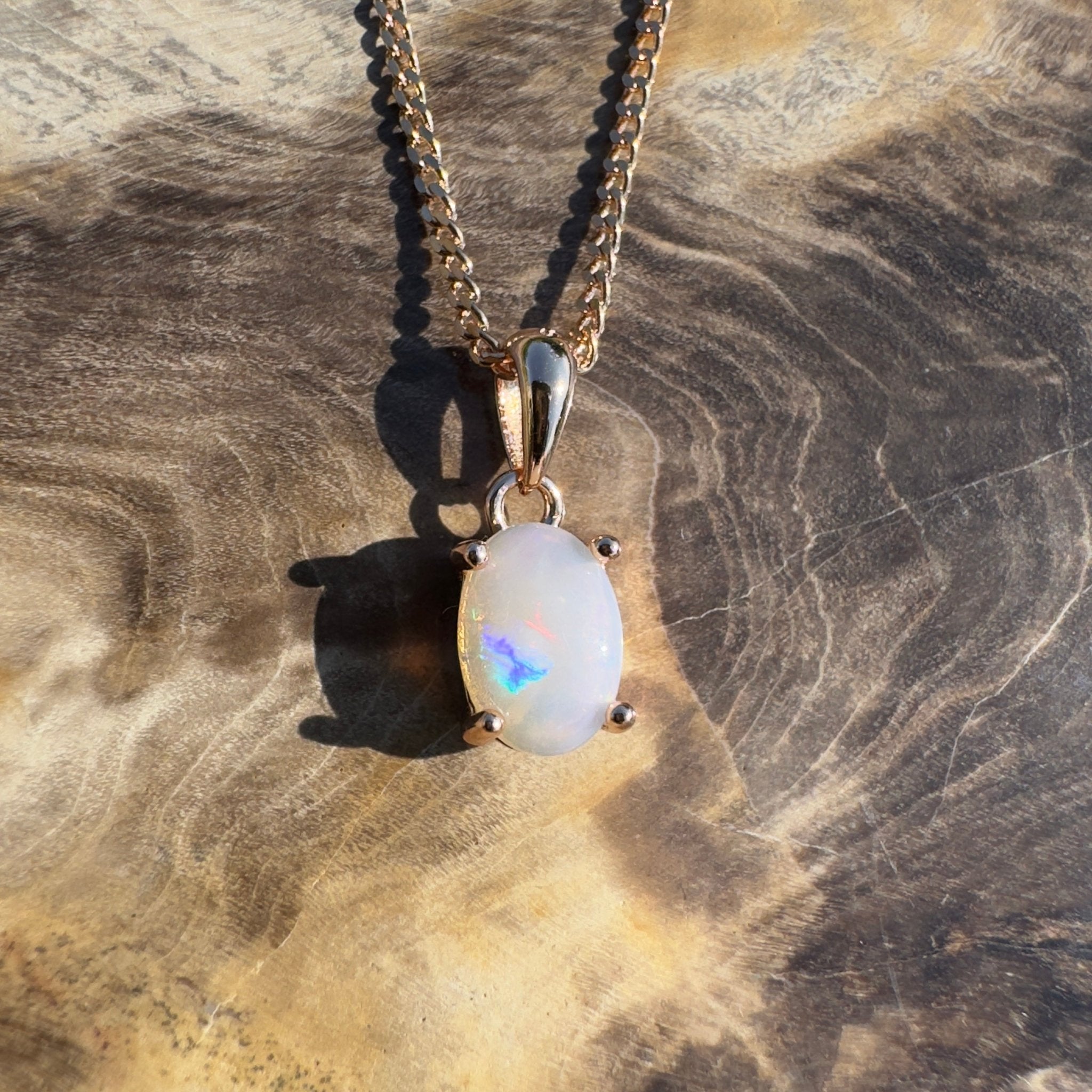 Nullarbor Grace - 0.6ct Coober Pedy Opal Rose Gold Coated 925 Silver Pendant