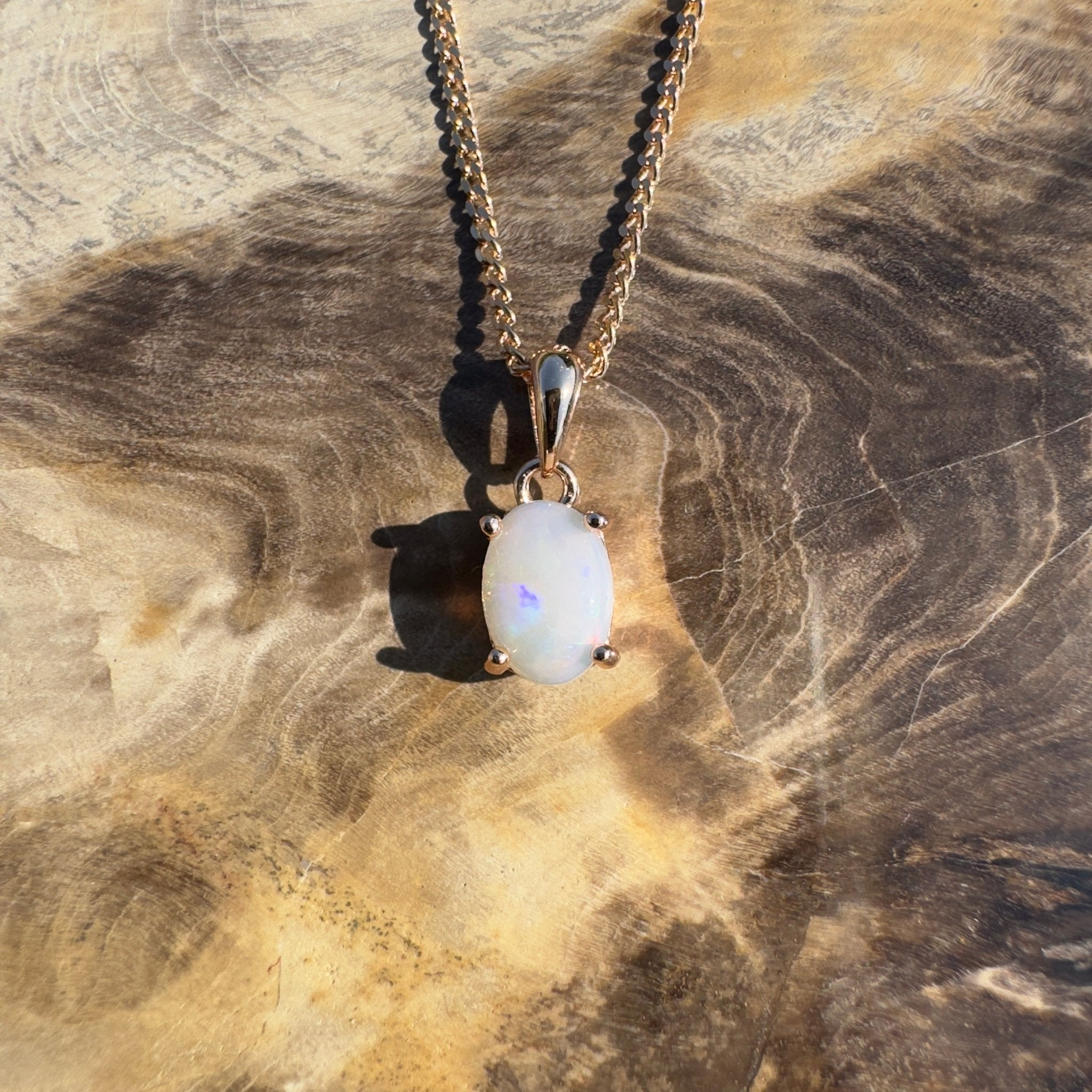 Nullarbor Grace - 0.6ct Coober Pedy Opal Rose Gold Coated 925 Silver Pendant