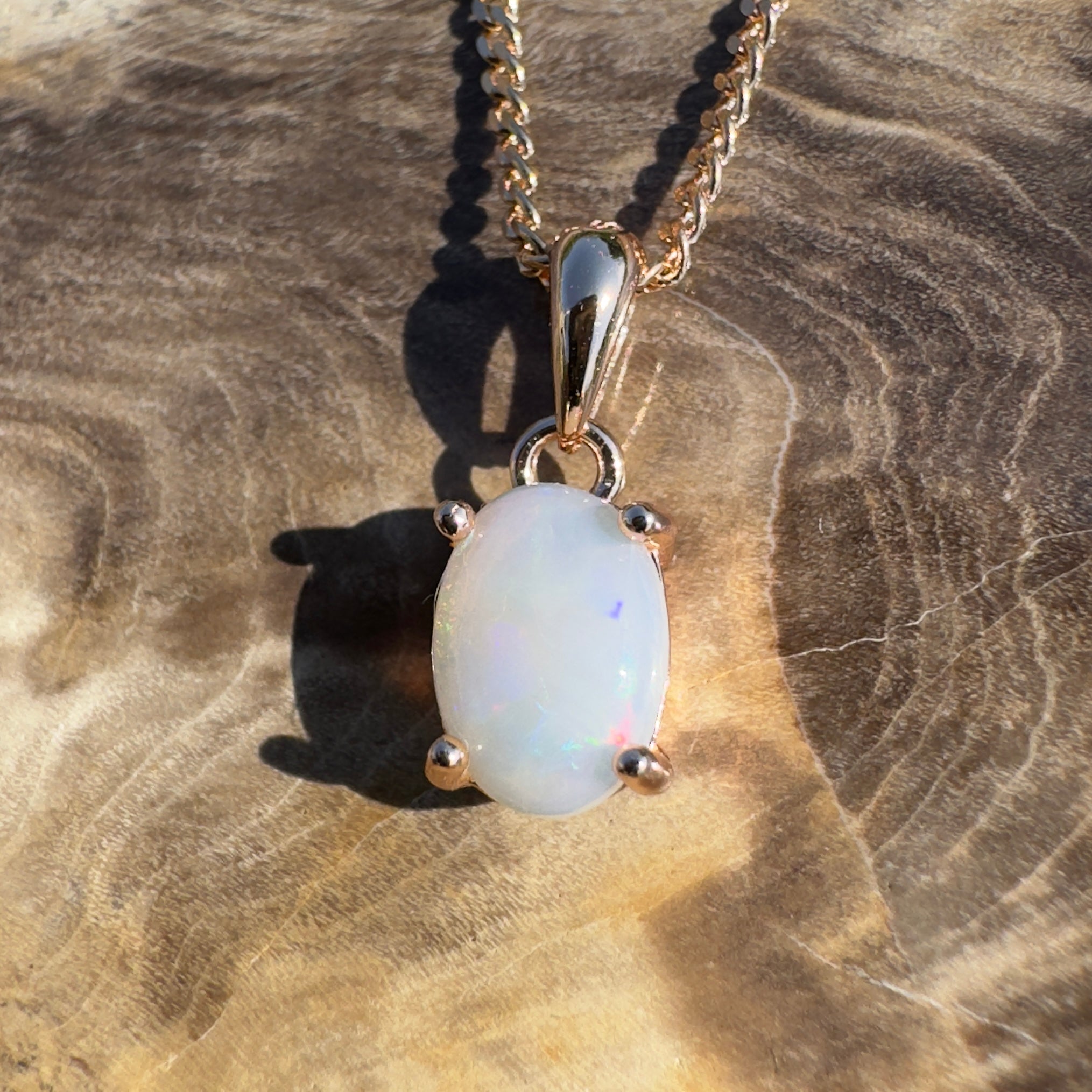 Nullarbor Grace - 0.6ct Coober Pedy Opal Rose Gold Coated 925 Silver Pendant