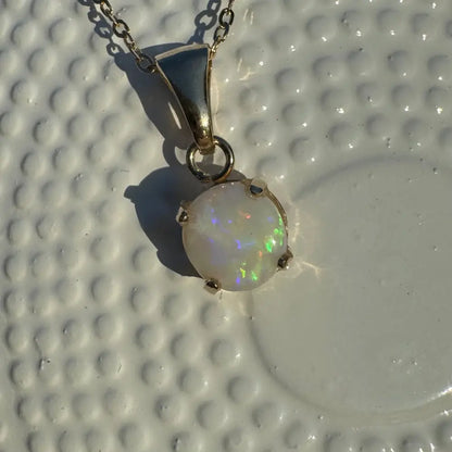 Silver necklace with iridescent Coober Pedy opal pendant from Outback Dreams collection