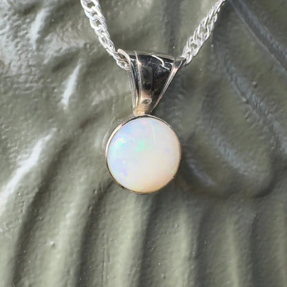 Silver pendant featuring a round Coober Pedy Opal from the Outback to Ocean collection