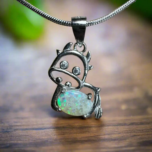 Silver cow pendant featuring a 0.4ct Lightning Ridge Opal and Cubic Zirconia in sterling silver