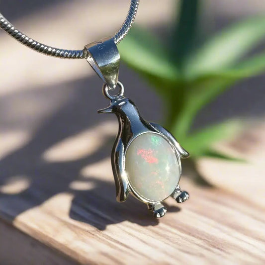 Silver penguin pendant with 1ct Coober Pedy opal on a sterling silver necklace