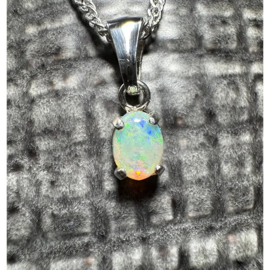Silver opal pendant from Port Douglas Light featuring a handcrafted 0.6ct Coober Pedy opal in sterling silver necklace