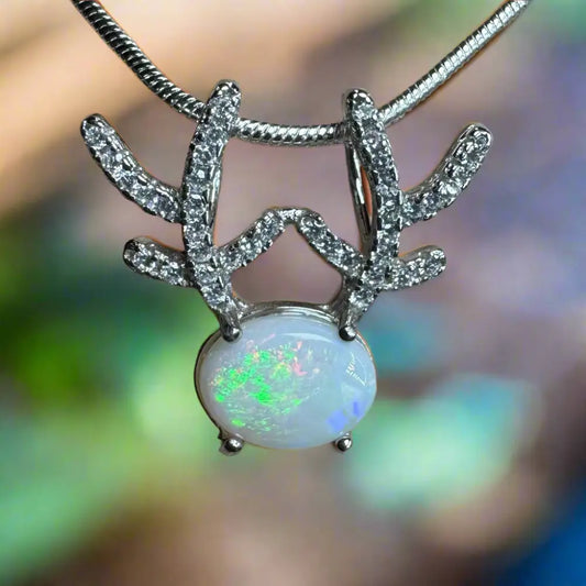 Opal pendant with diamond-studded silver antlers from Rainbow Reindeer necklace collection