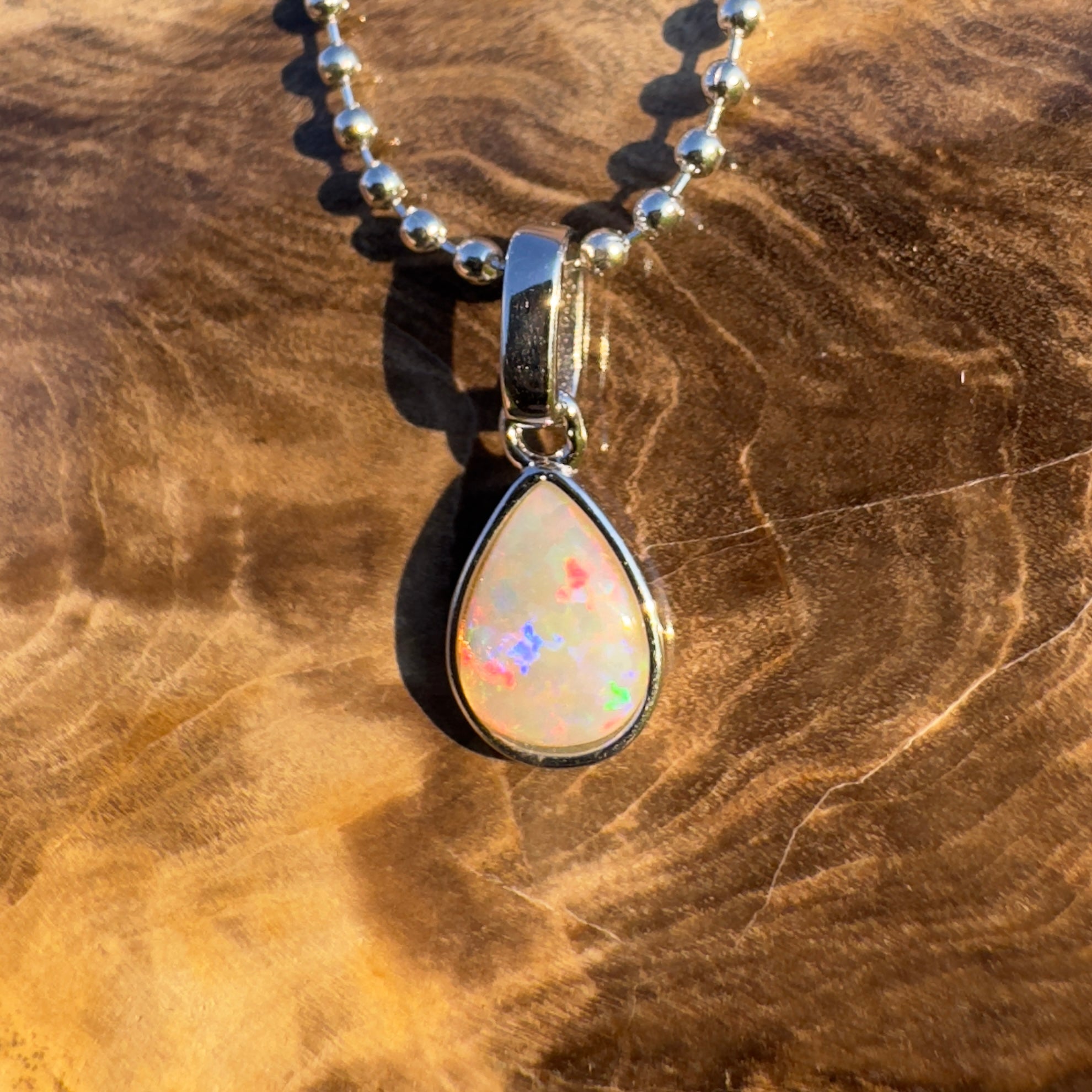 Rainlight Glow ~ Handcrafted 0.7ct Coober Pedy Crystal Opal Pendant – Silver Elegance.