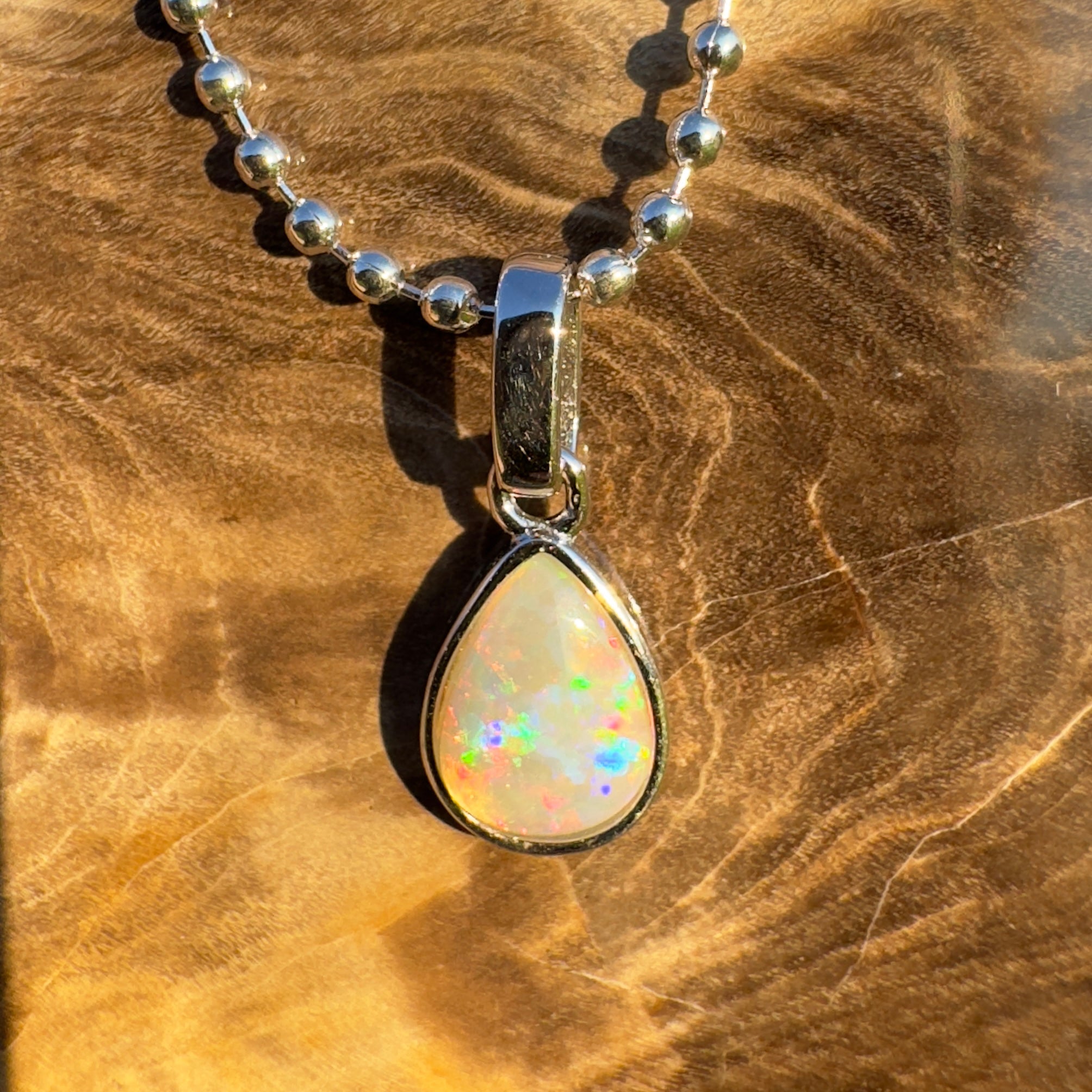 Rainlight Glow ~ Handcrafted 0.7ct Coober Pedy Crystal Opal Pendant – Silver Elegance.