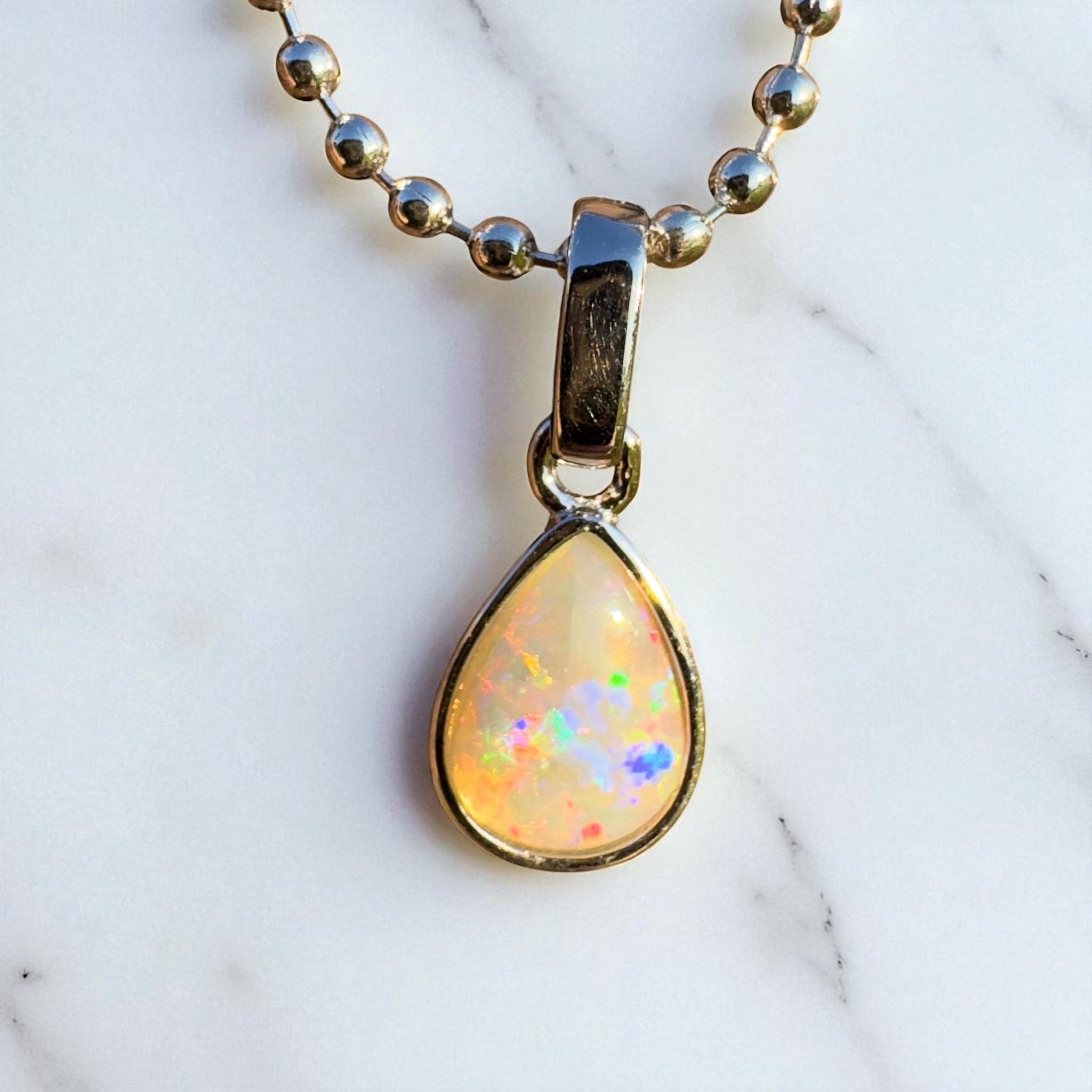 Rainlight Glow ~ Handcrafted 0.7ct Coober Pedy Crystal Opal Pendant – Silver Elegance.