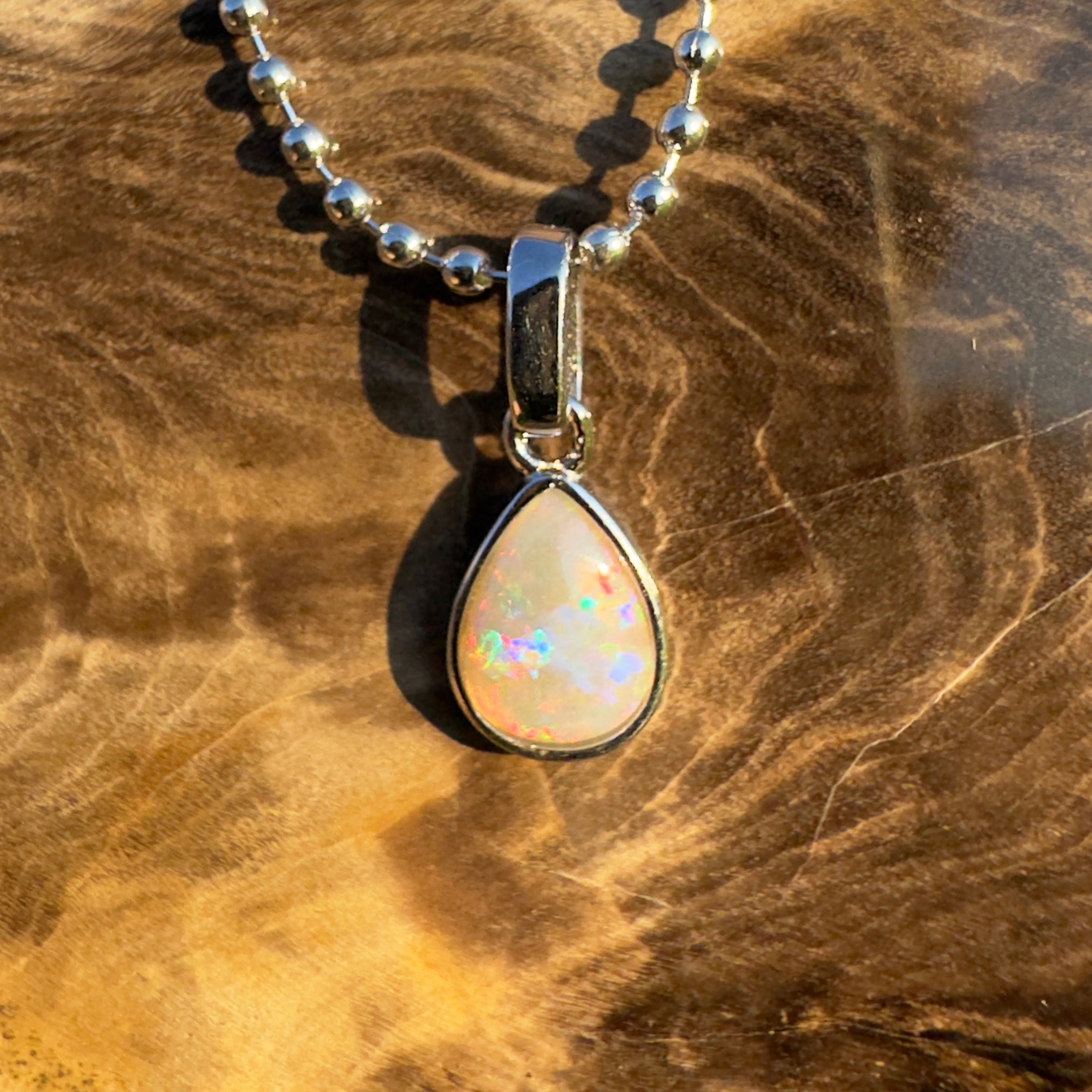 Rainlight Glow ~ Handcrafted 0.7ct Coober Pedy Crystal Opal Pendant – Silver Elegance.