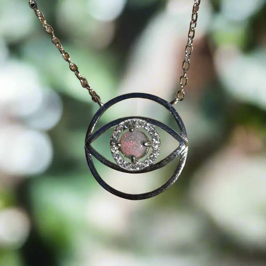 Silver eye-shaped pendant necklace featuring a 0.3 carat Lightning Ridge Opal eye in sterling silver