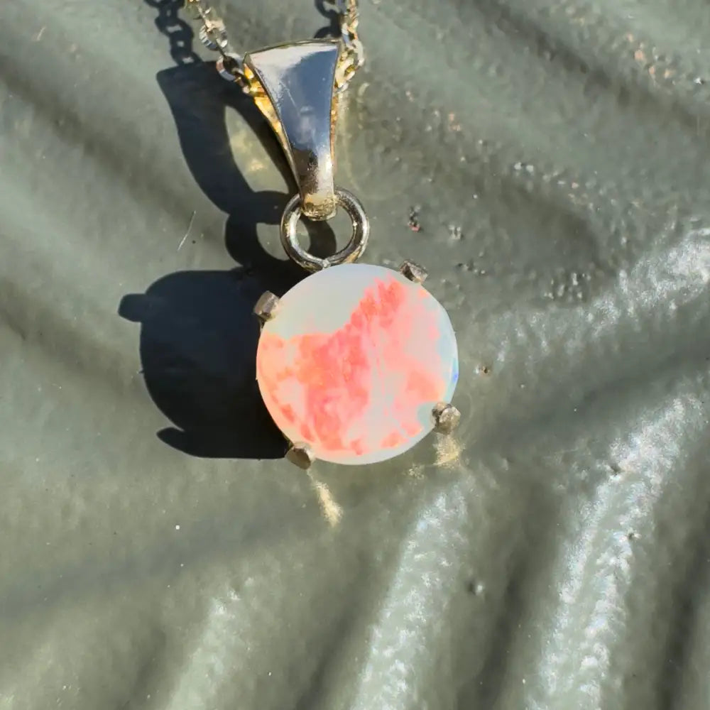 Silver pendant with round Lightning Ridge Opal from the Red Sky at Night collection