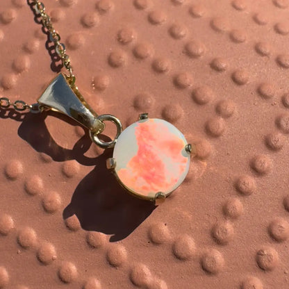 Gold chain necklace with round Lightning Ridge opal pendant from Red Sky at Night collection