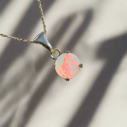 Silver necklace with a Lightning Ridge opal pendant from the Red Sky at Night collection