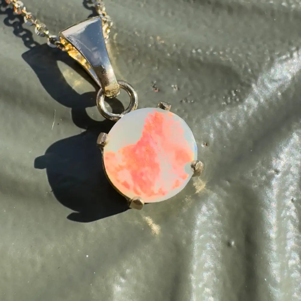 Silver opal pendant necklace featuring a handcrafted 9ct solid gold Lightning Ridge opal from the Red Sky at Night collection