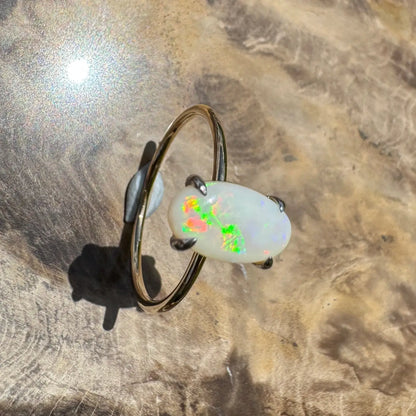 Opal gemstone ring with colorful play-of-color in yellow gold handcrafted jewelry