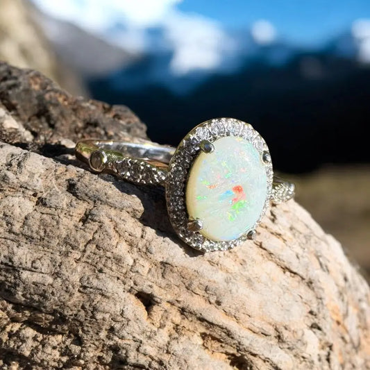 Oval opal ring with diamond halo from Snowy Peaks handcrafted sterling silver jewelry