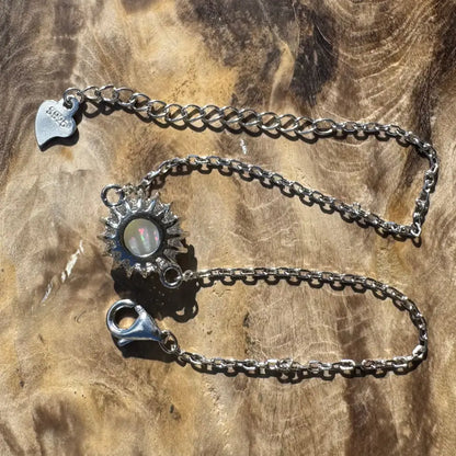Silver sunburst opal bracelet.