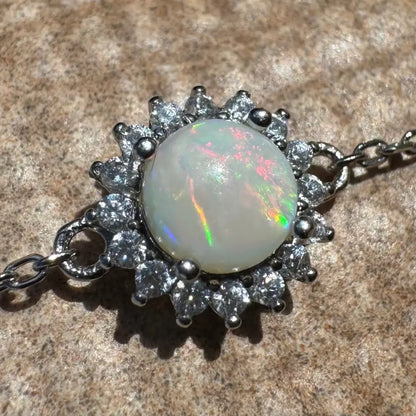 Opal and diamond pendant necklace.