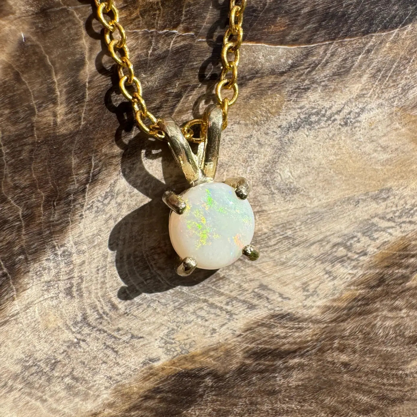Gold chain necklace with a Coober Pedy opal pendant from the Sunflare handcrafted gold collection